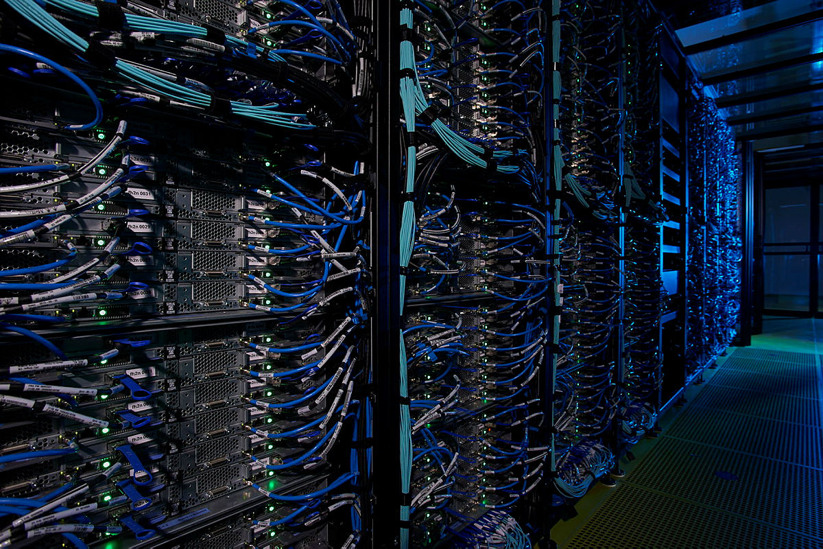 data center server rack with blue cables